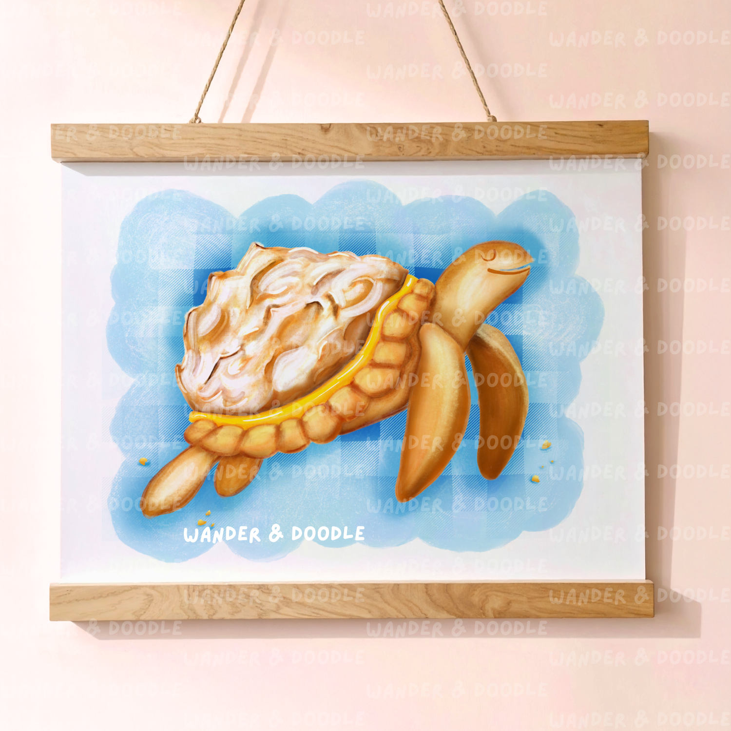 Framed illustration of a turtle  in the shape of a lemon meringue pie  with a blue background, featuring the brand 'Wander & Doodle'.
