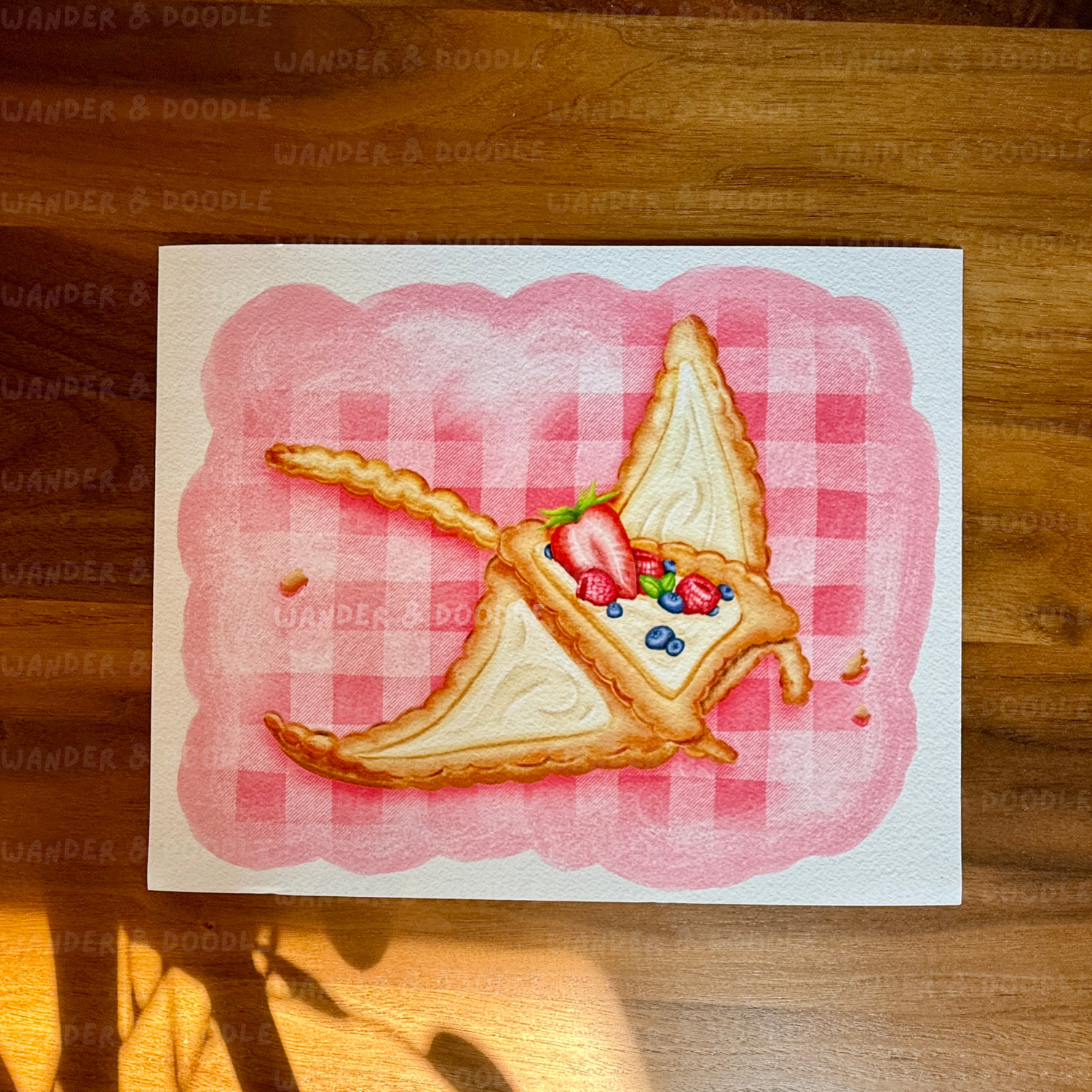 Illustration of a slice of pie in the shape of a manta ray with berries on a pink checkered background, placed on a wooden surface.