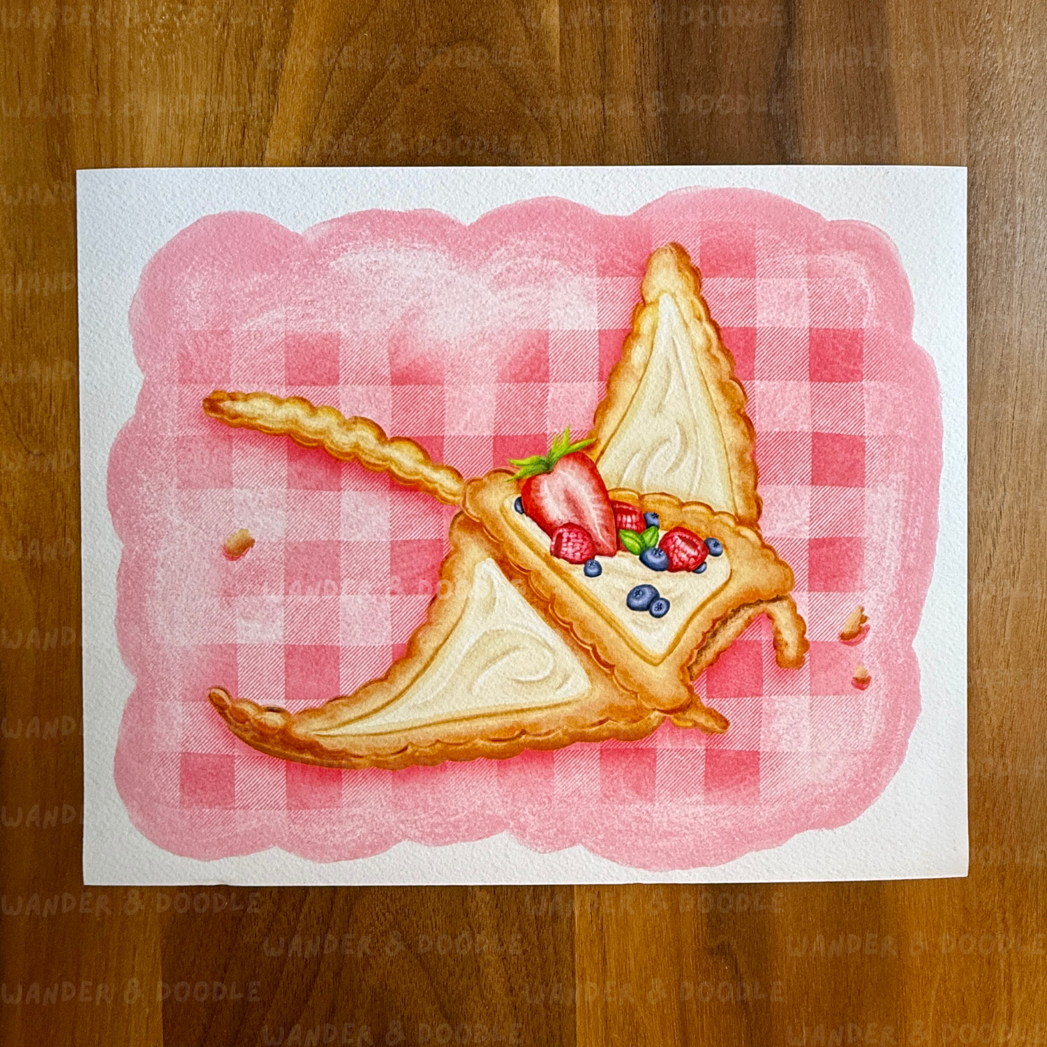 Illustration of a slice of pie in the shape of a manta ray with berries on a pink checkered background